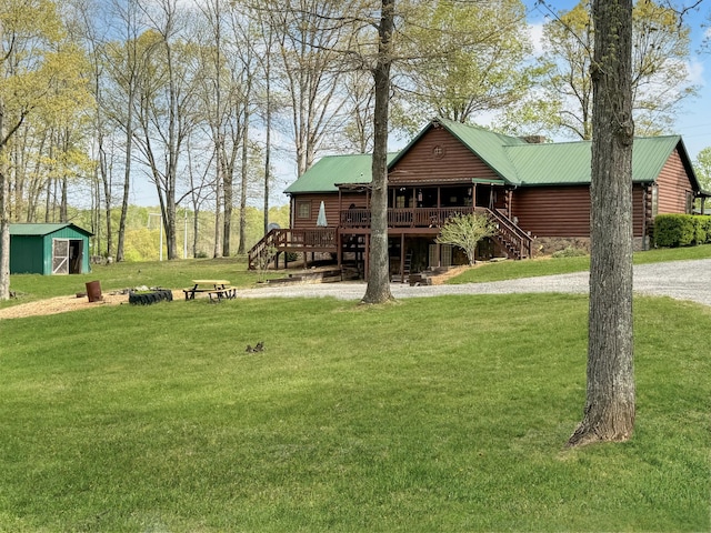 130 Wayne Threatt Rd, Dover, TN 37058 - view of yard with an outbuilding, a deck, and stairs