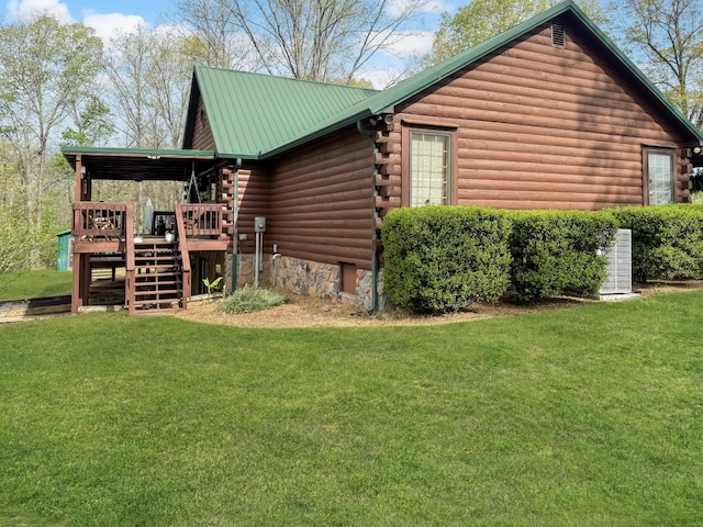 130 Wayne Threatt Rd, Dover, TN 37058 - view of property exterior featuring stairs, a deck, a lawn, and log exterior