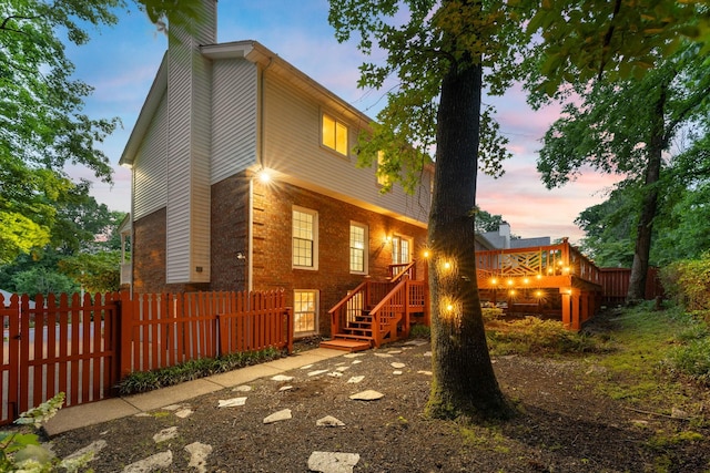 429 Old Oak Way, Hermitage, TN 37076 - back of property at dusk featuring a chimney and brick siding