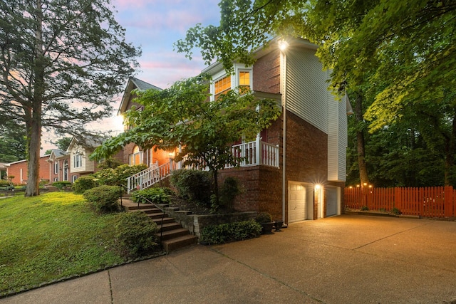 429 Old Oak Way, Hermitage, TN 37076 - view of front of property featuring a garage, brick siding, fence, concrete driveway, and stairs