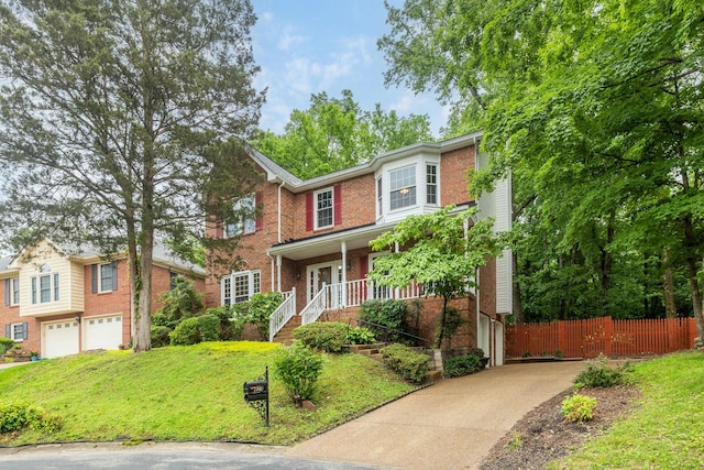 429 Old Oak Way, Hermitage, TN 37076 - view of front of home featuring an attached garage, concrete driveway, brick siding, covered porch, and stairs