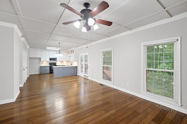 429 Old Oak Way, Hermitage, TN 37076 - unfurnished living room with healthy amount of natural light, baseboards, dark wood-style flooring, ceiling fan, and coffered ceiling