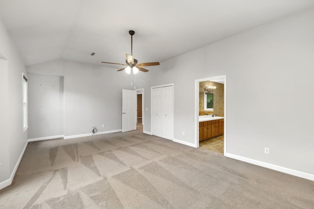 429 Old Oak Way, Hermitage, TN 37076 - unfurnished bedroom with light colored carpet, baseboards, vaulted ceiling, connected bathroom, and a closet