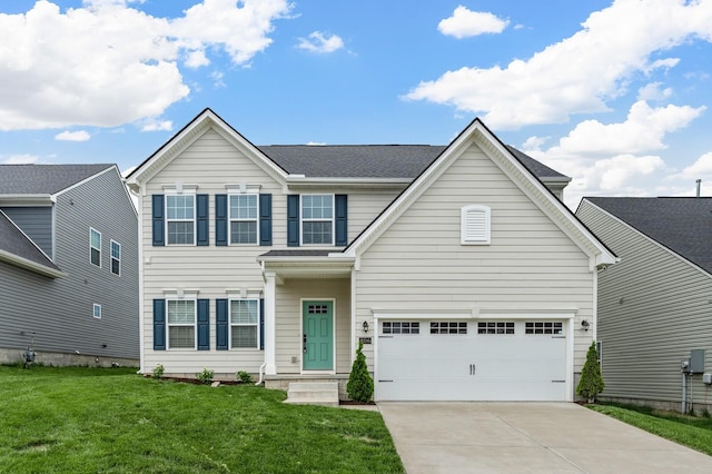 traditional home with a front lawn, driveway, and an attached garage