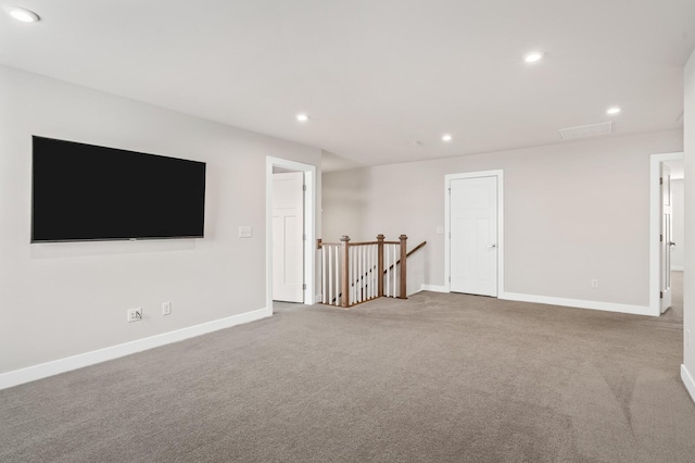 interior space with baseboards and recessed lighting