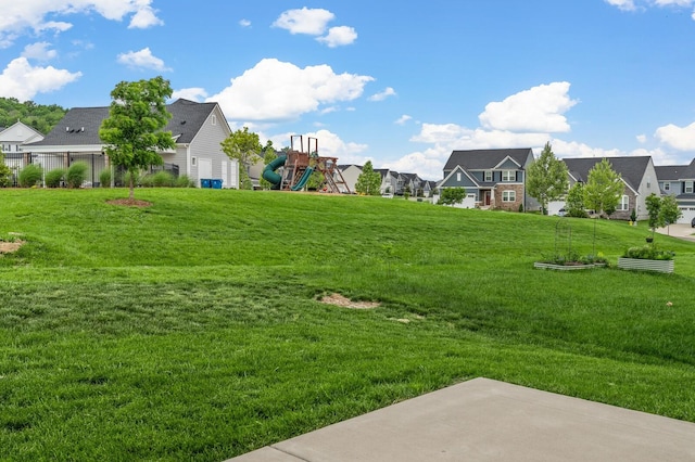 view of yard featuring a residential view and a playground