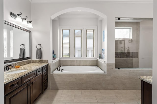4029 Kings Camp Pass, Arrington, TN 37014 - bathroom featuring a bath, tile patterned flooring, vanity, and a walk in shower