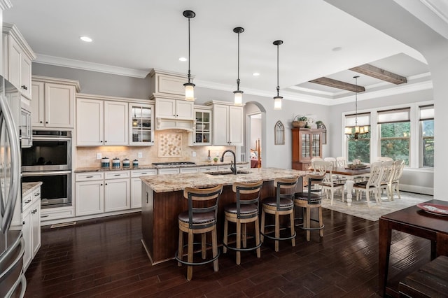 4029 Kings Camp Pass, Arrington, TN 37014 - kitchen featuring a sink, stainless steel appliances, dark wood finished floors, light stone countertops, and backsplash