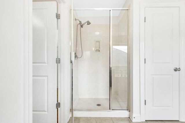 bathroom featuring a shower stall and tile patterned floors