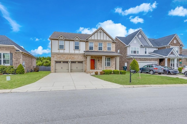 tudor house featuring concrete driveway, brick siding, an attached garage, and a front lawn