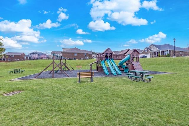 community playground featuring a yard and a residential view