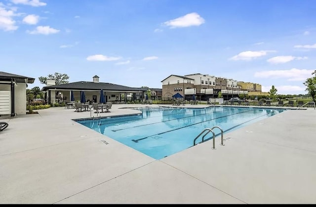 pool with a patio area