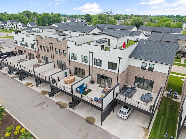 rear view of house featuring outdoor dining area, a residential view, and an outdoor living space
