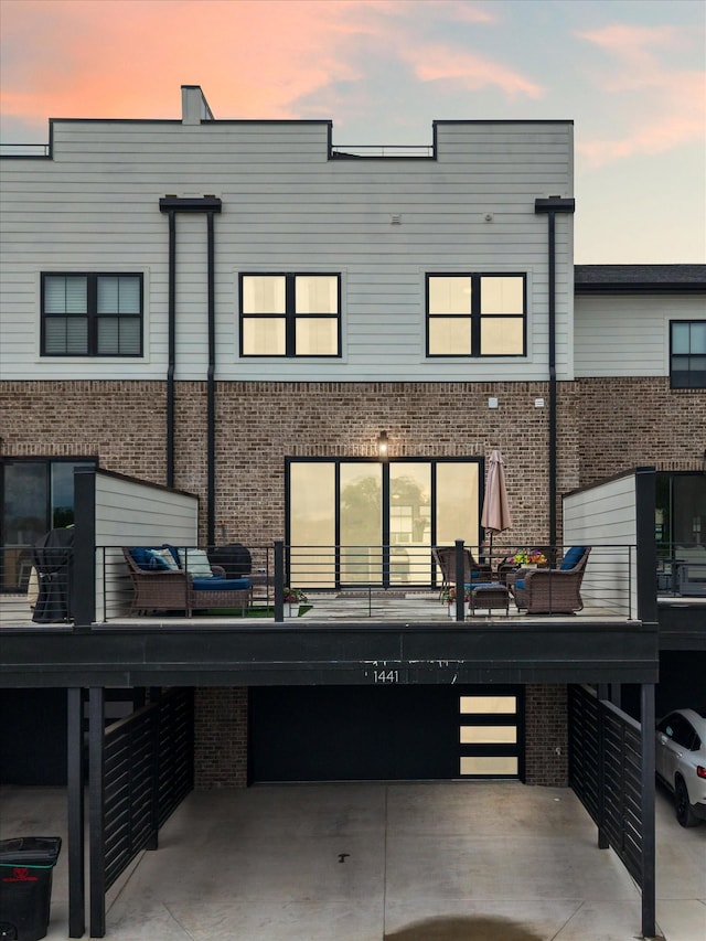 rear view of property featuring brick siding