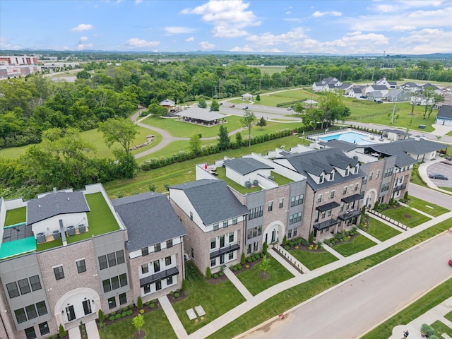 birds eye view of property with a residential view