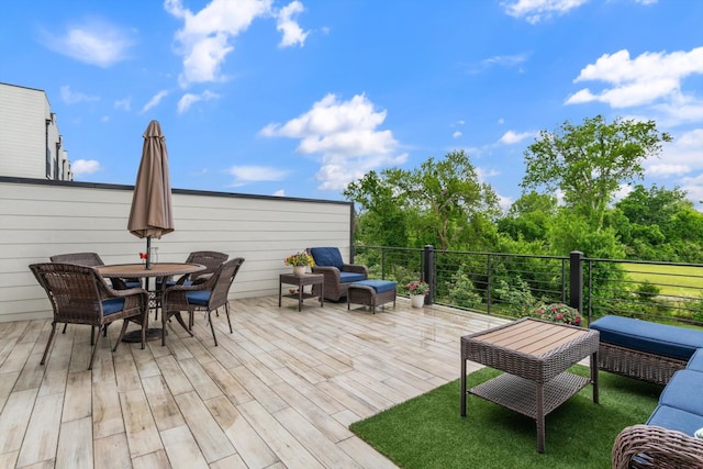wooden deck with outdoor dining space
