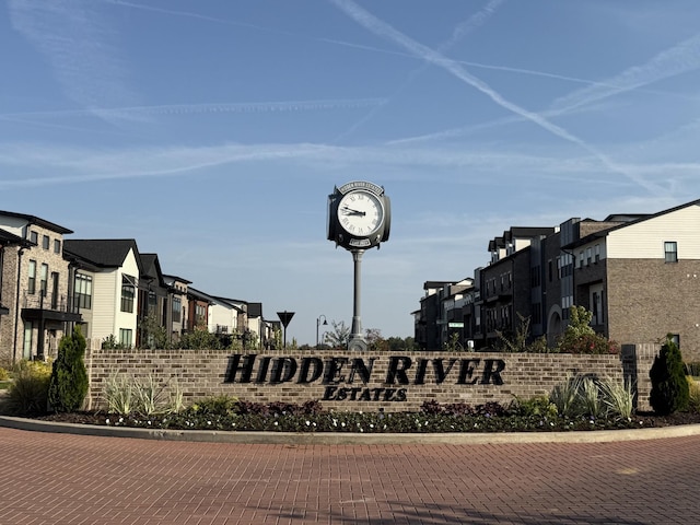community / neighborhood sign featuring a residential view