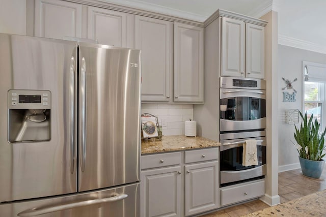 2105 Chels Way, Old Hickory, TN 37138 - kitchen featuring baseboards, light stone countertops, appliances with stainless steel finishes, decorative backsplash, and ornamental molding