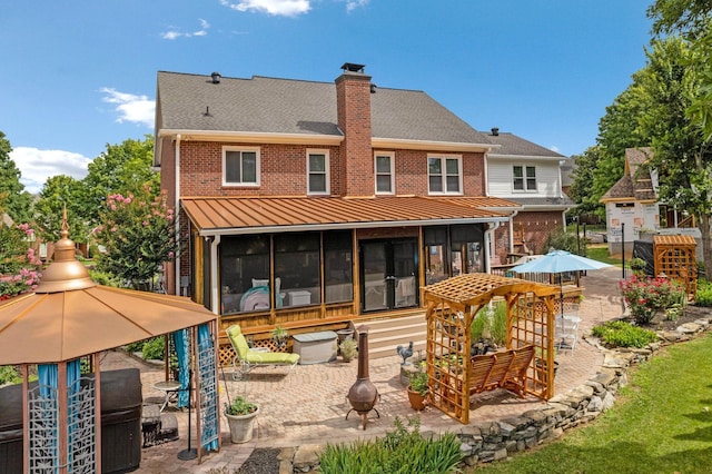 2105 Chels Way, Old Hickory, TN 37138 - rear view of property with a sunroom, brick siding, a chimney, and a patio area