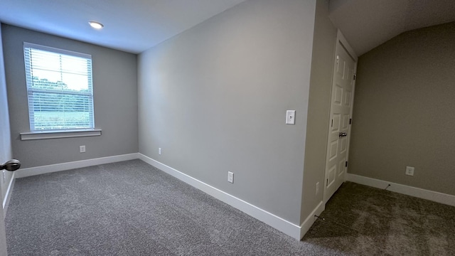 spare room featuring baseboards and carpet flooring