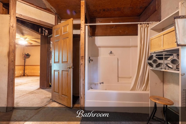 bathroom with shower / bath combo with shower curtain