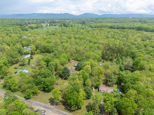 bird's eye view with a wooded view and a mountain view