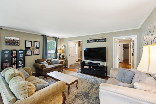 living area with wood finished floors and ornamental molding
