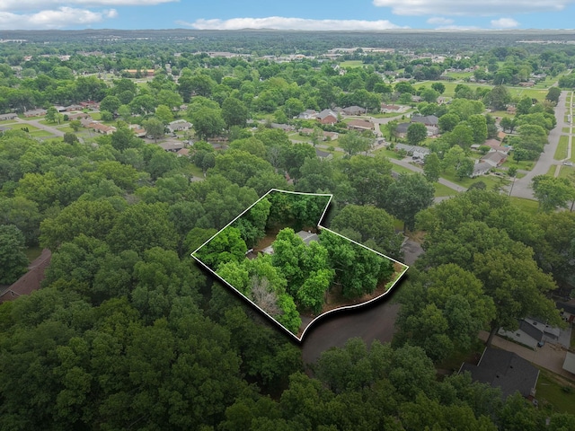 aerial view featuring a wooded view