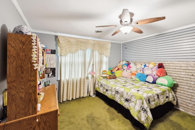 carpeted bedroom with ornamental molding, a ceiling fan, and visible vents