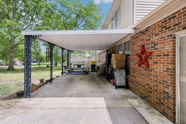 view of car parking with concrete driveway and an attached carport