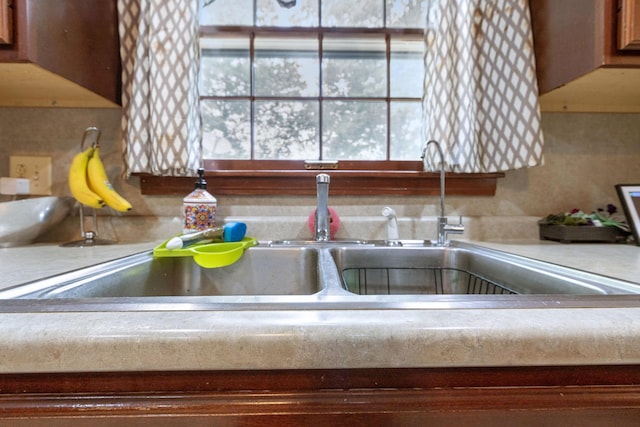 details with light countertops and a sink