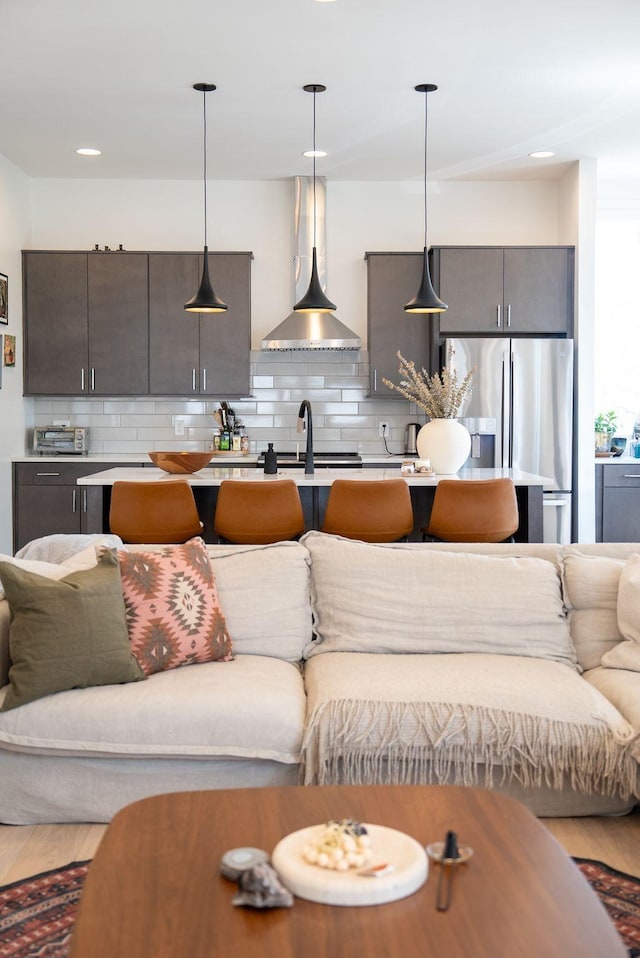 living area featuring recessed lighting and wood finished floors
