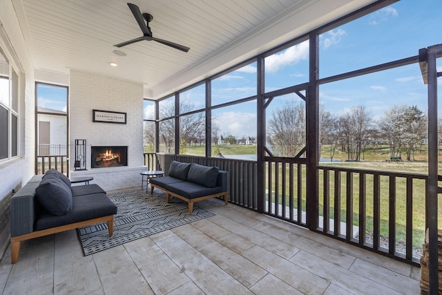 5734 Willoughby Way, Murfreesboro, TN 37129 - sunroom with ceiling fan, a wealth of natural light, and a brick fireplace