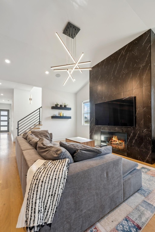 5734 Willoughby Way, Murfreesboro, TN 37129 - living area featuring recessed lighting, a chandelier, an accent wall, vaulted ceiling, and wood finished floors