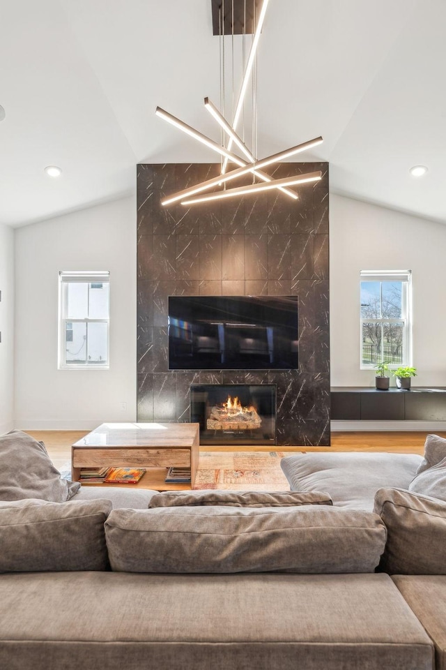 5734 Willoughby Way, Murfreesboro, TN 37129 - living area featuring lofted ceiling, a healthy amount of sunlight, a premium fireplace, and recessed lighting