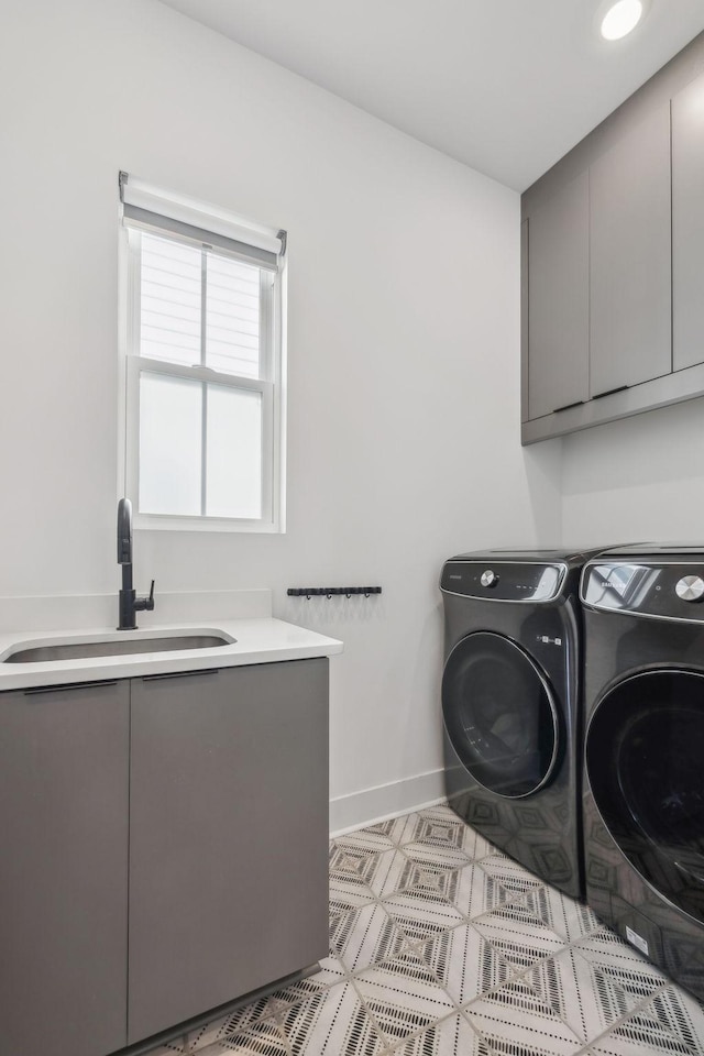 5734 Willoughby Way, Murfreesboro, TN 37129 - washroom with a sink, washing machine and clothes dryer, cabinet space, and baseboards
