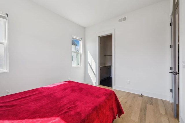 5734 Willoughby Way, Murfreesboro, TN 37129 - bedroom featuring baseboards, visible vents, and wood finished floors