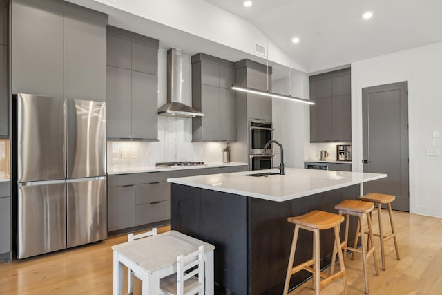 5734 Willoughby Way, Murfreesboro, TN 37129 - kitchen featuring a sink, wall chimney exhaust hood, stainless steel appliances, gray cabinets, and modern cabinets