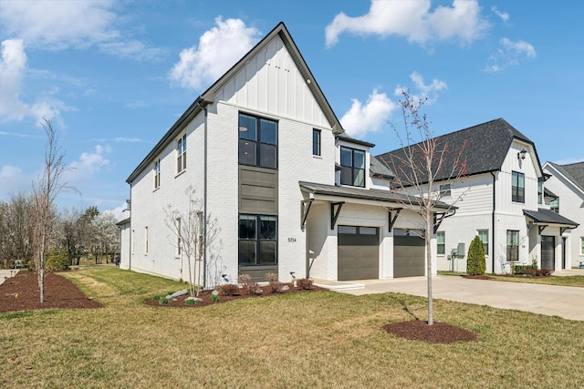 5734 Willoughby Way, Murfreesboro, TN 37129 - view of front of house featuring an attached garage, board and batten siding, a front yard, brick siding, and driveway