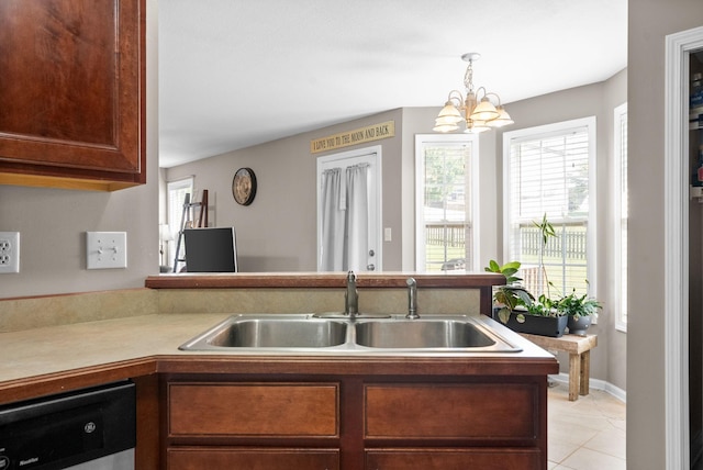 3144 Holly Pt, Clarksville, TN 37043 - kitchen with a sink, decorative light fixtures, an inviting chandelier, light tile patterned floors, and stainless steel dishwasher