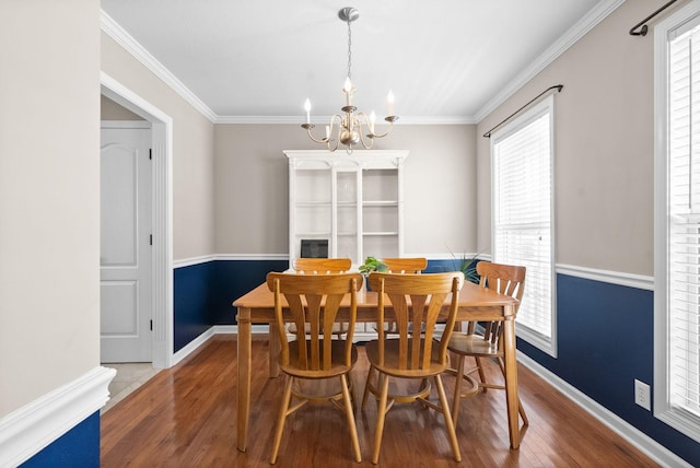 3144 Holly Pt, Clarksville, TN 37043 - dining area with an inviting chandelier, wood finished floors, baseboards, and a healthy amount of sunlight
