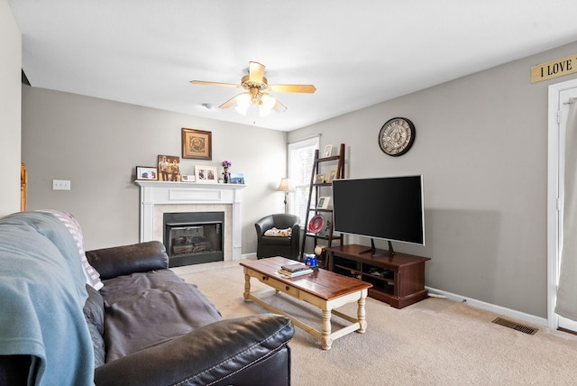 3144 Holly Pt, Clarksville, TN 37043 - living room featuring baseboards, visible vents, ceiling fan, a fireplace, and carpet floors