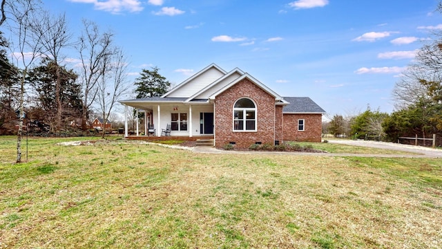 view of front facade featuring covered porch, a front yard, brick siding, and crawl space