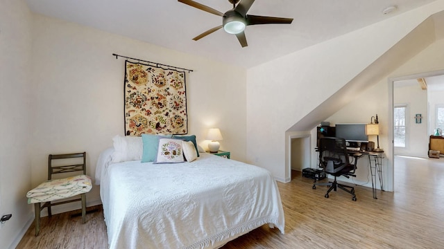 bedroom with wood finished floors, baseboards, and ceiling fan