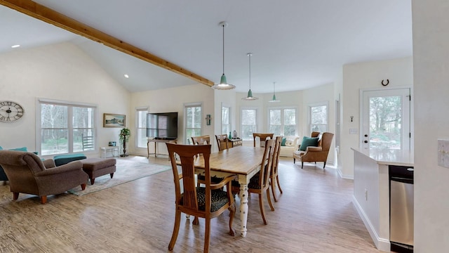 dining area with baseboards, a wealth of natural light, and light wood-style floors