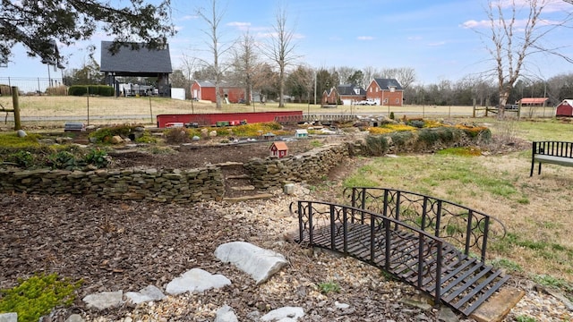 view of yard with an outdoor structure and fence