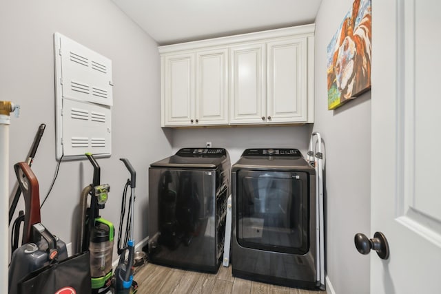 855 Sneed Blvd, Lafayette, TN 37083 - clothes washing area with light wood finished floors, cabinet space, baseboards, and washer and dryer