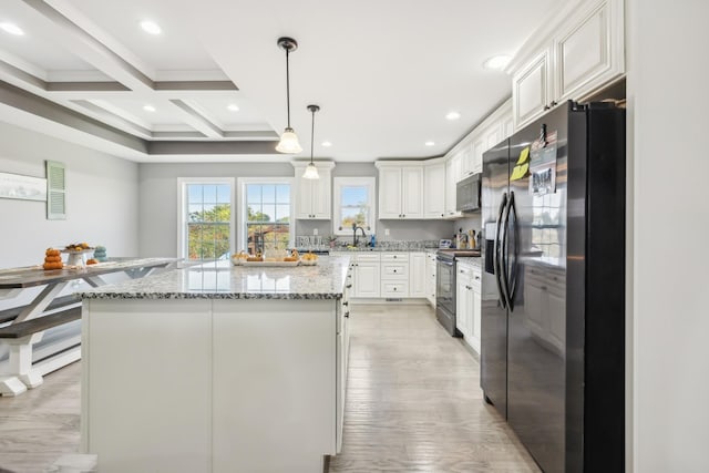 855 Sneed Blvd, Lafayette, TN 37083 - kitchen featuring black appliances, beamed ceiling, white cabinets, light stone countertops, and a kitchen island