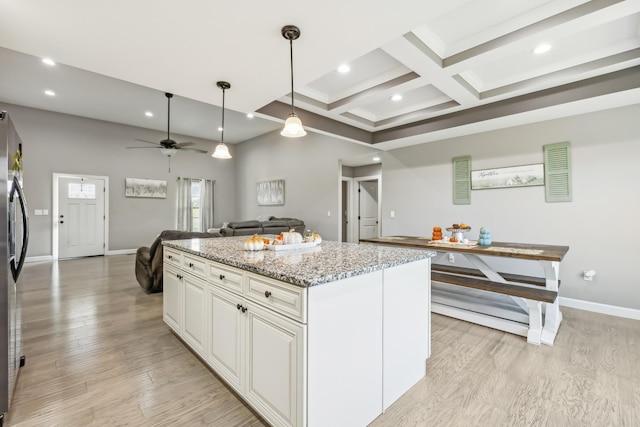 855 Sneed Blvd, Lafayette, TN 37083 - kitchen with coffered ceiling, beam ceiling, open floor plan, baseboards, and a kitchen island