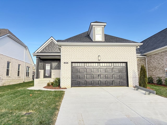 209 Hudson Dr, Gallatin, TN 37066 - view of front facade with brick siding, an attached garage, driveway, and a front yard